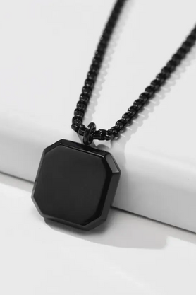 Black geometric pendant necklace on chain