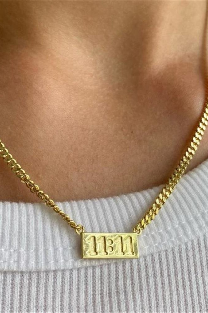 11:11 gold-tone rectangular pendant necklace worn
