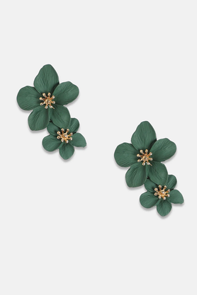 Emerald green floral dangle earrings worn on model