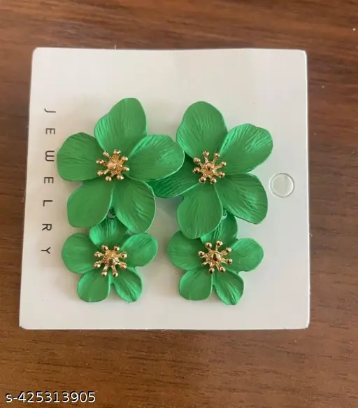 Green floral dangle earrings styled on model