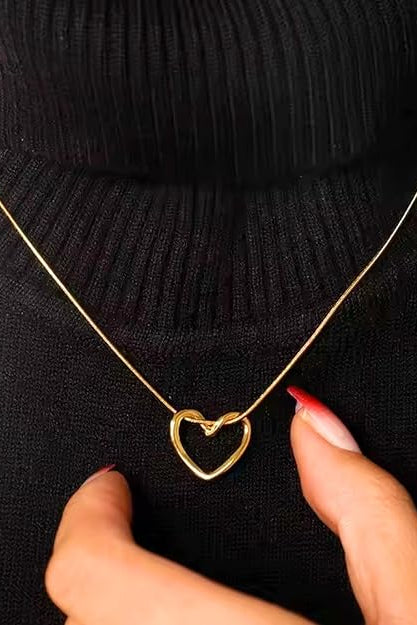 Gold-tone heart pendant necklace with adjustable extension chain