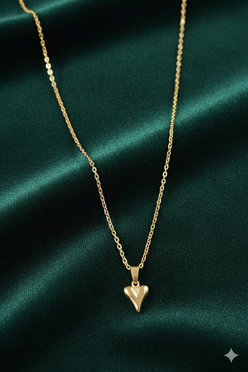 Gold-tone heart arrow pendant necklace close-up