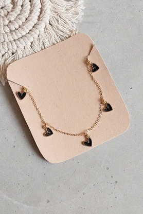 Gold-tone necklace with multiple black heart charms