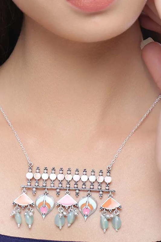Multicolour silver-tone statement necklace worn as a layered pendant style