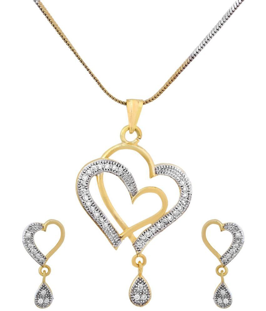 Heart pendant necklace and matching earrings worn with casual outfit