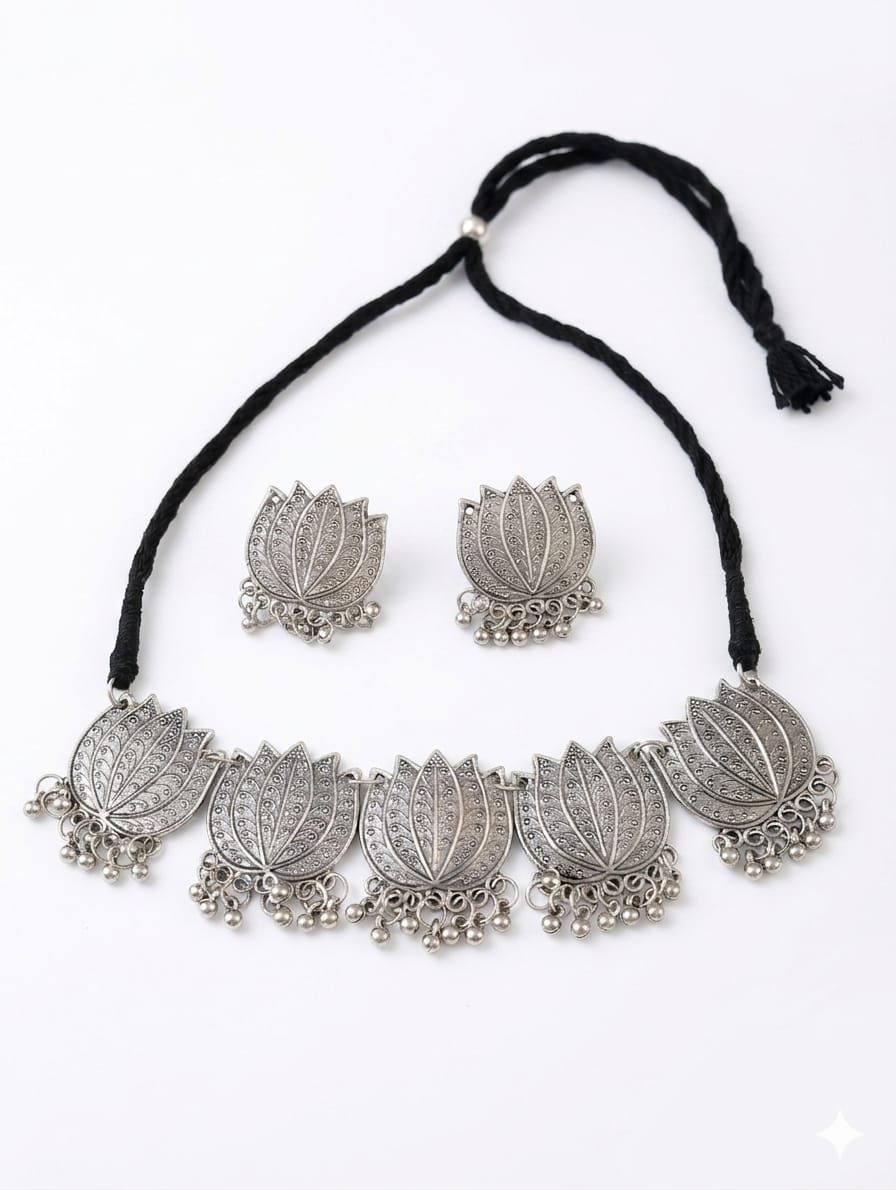 Silver oxidised lotus choker set worn with traditional attire