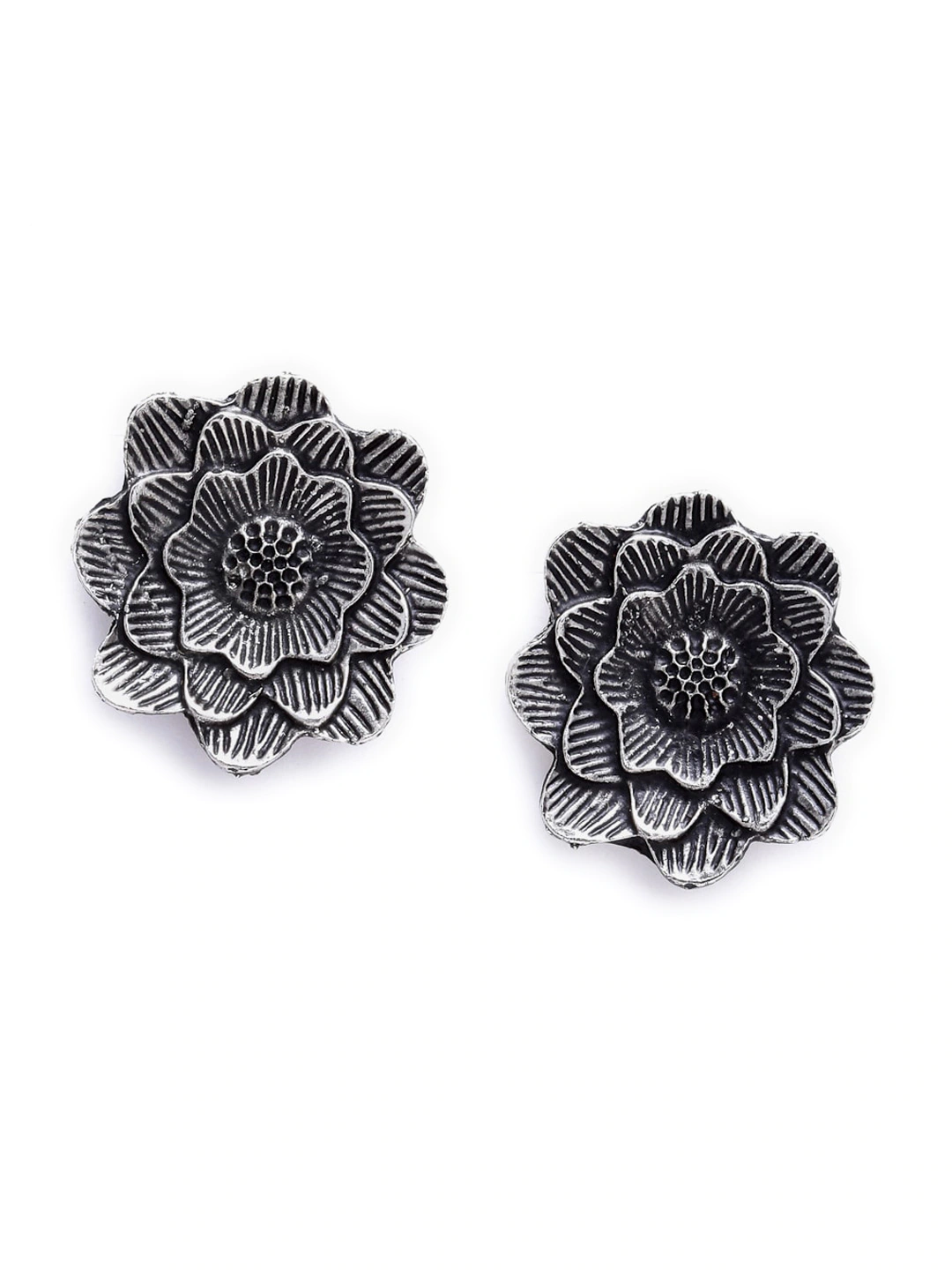 Oxidised silver-tone floral stud earrings close-up