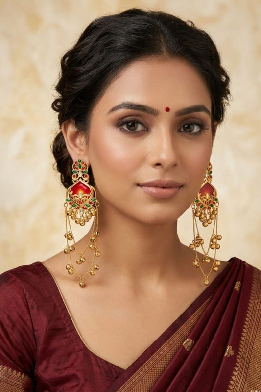 Red and green traditional long jhumka earrings worn on model