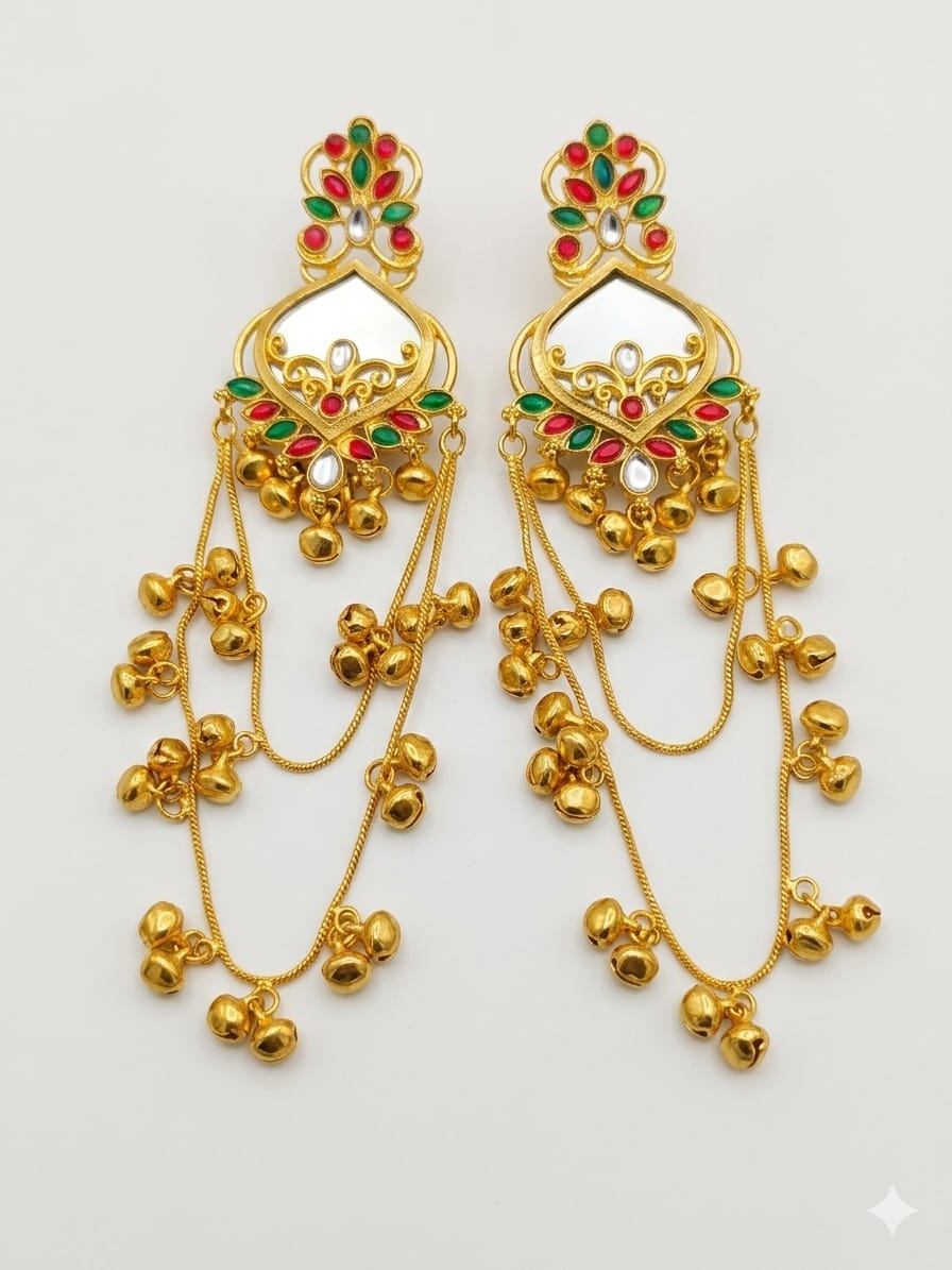 White red and green traditional long jhumka earrings on a white background