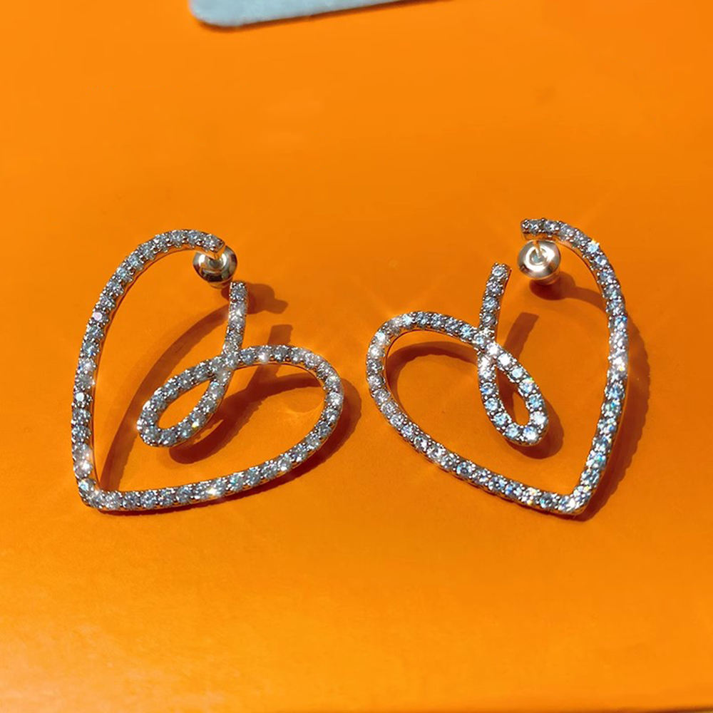 Crystal-pave heart earrings lifestyle image