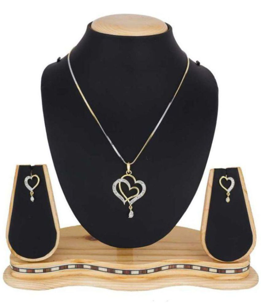 Close-up of gold-tone heart pendant necklace with matching earrings