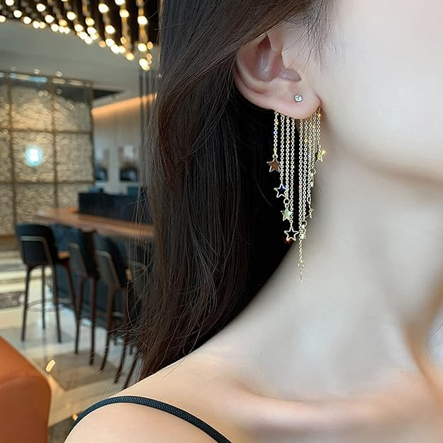 Gold-tone star chain earrings detail