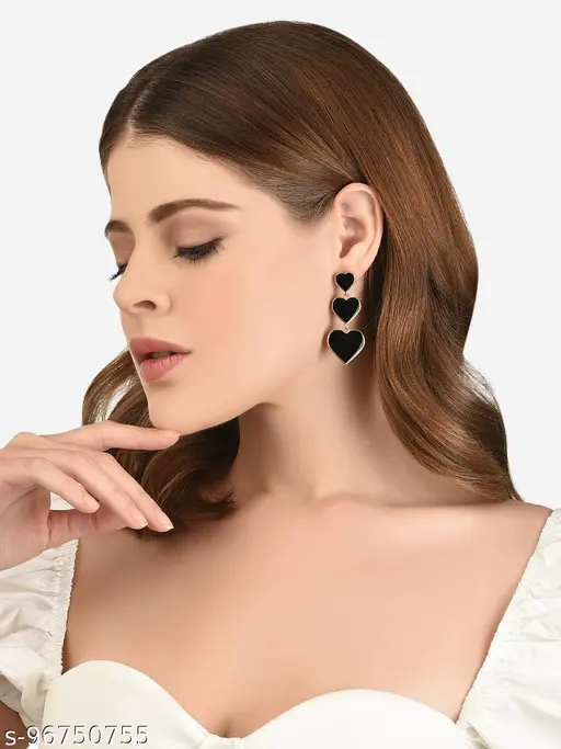 Black heart three-tier drop earrings worn with outfit