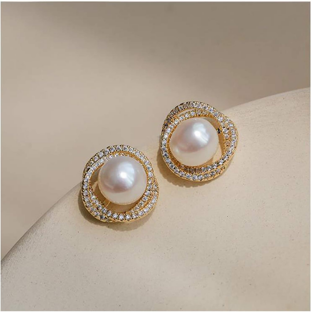 Gold-tone pearl stud earrings with crystal halo