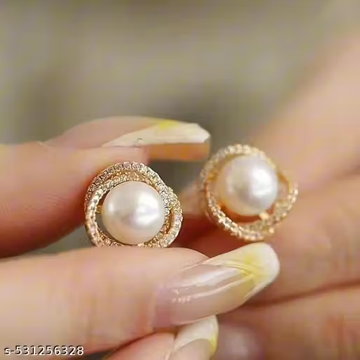 Gold-tone pearl stud earrings close-up