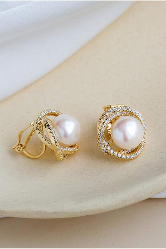 Pearl crystal stud earrings worn close-up