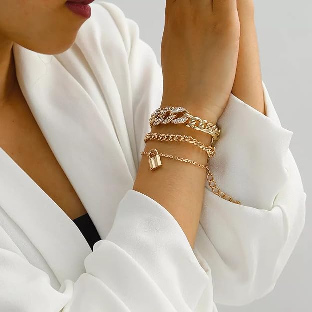 Gold-tone layered bracelet worn on wrist