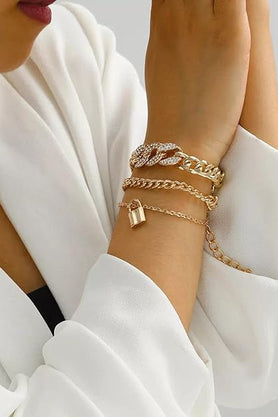 Gold-tone layered bracelet worn on wrist