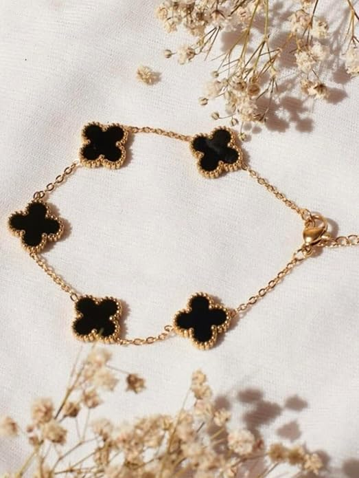 Black clover charm bracelet with gold-tone chain