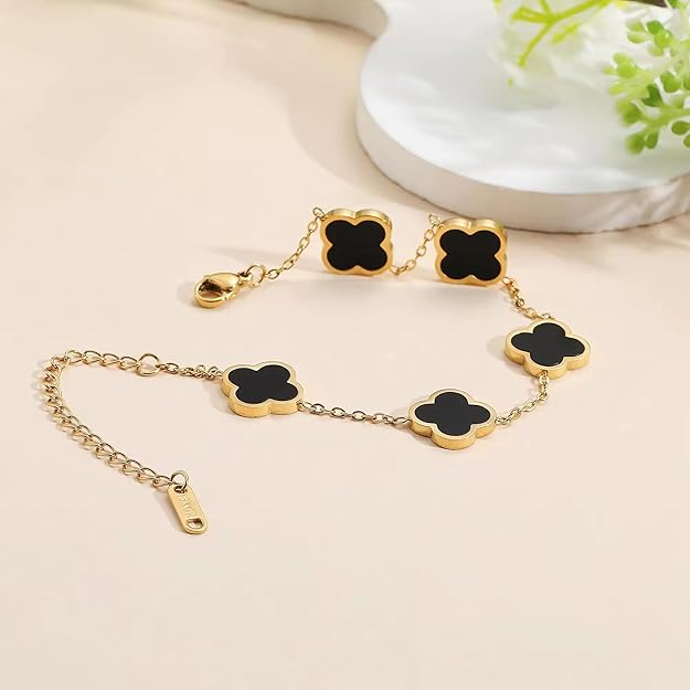 Black clover charm bracelet on wrist