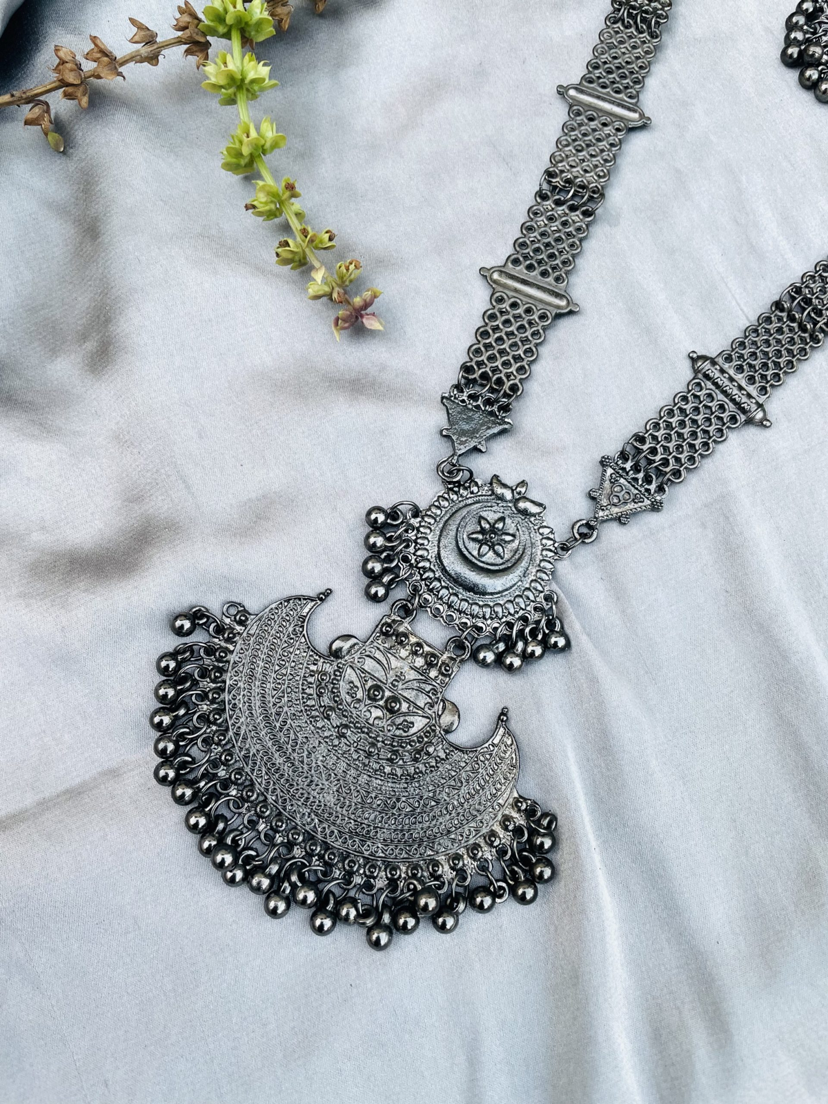 Oxidised silver-tone crescent pendant necklace set with matching earrings