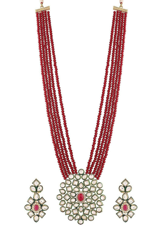 Red multi-strand beaded necklace with ornate pendant and matching earrings